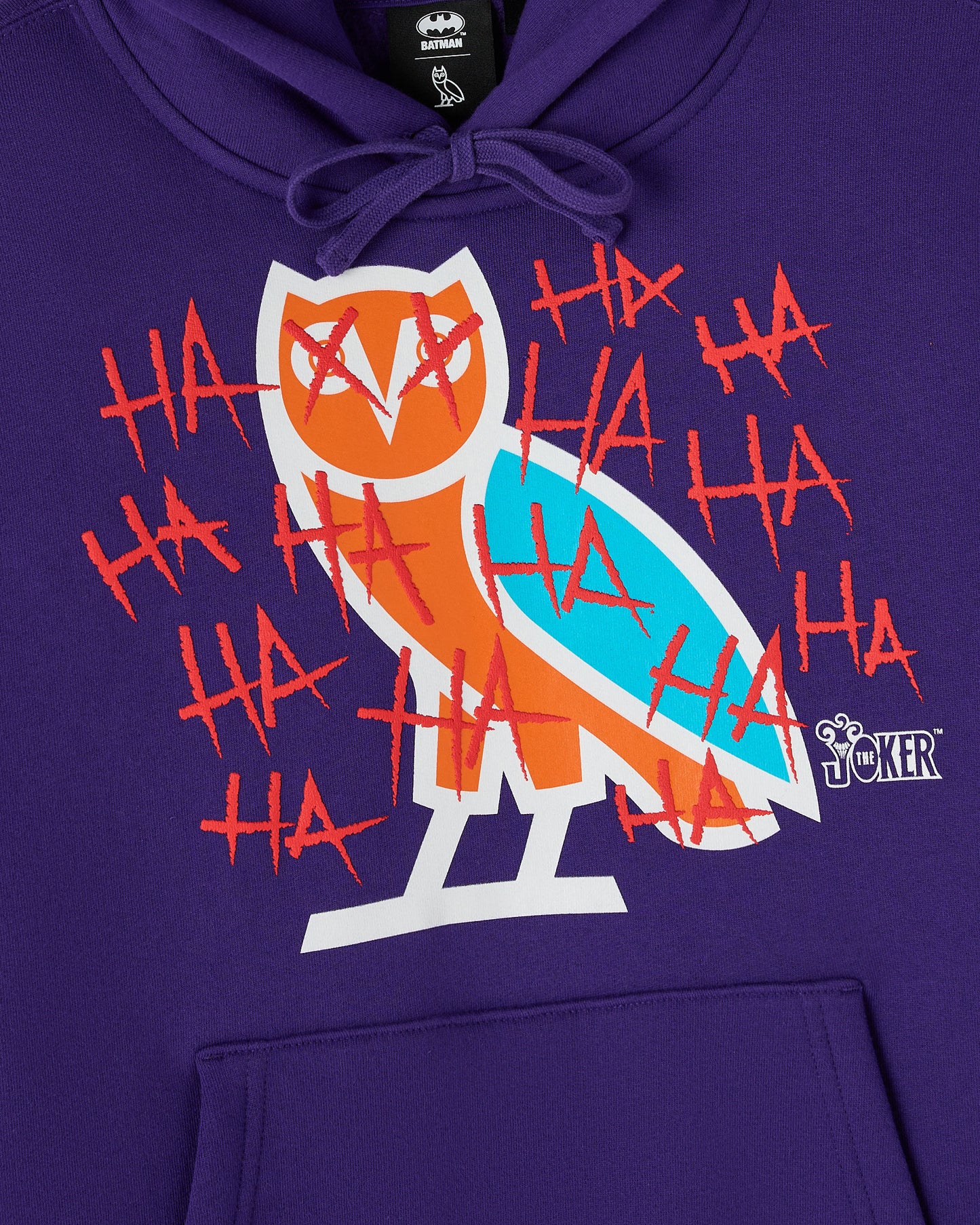 Violet hoodie with graphic of stylized owl face in orange and cyan, surrounded by red "HA" text and claw marks.