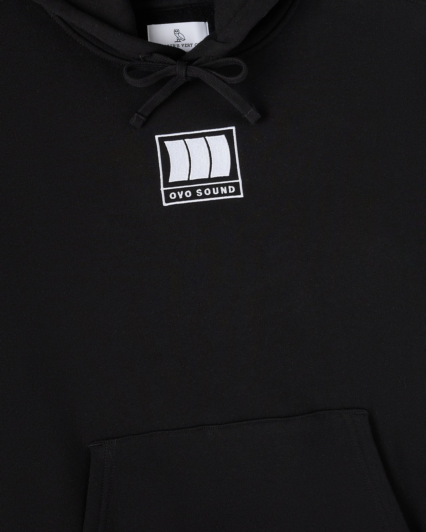 Black hoodie with white OVO Sound logo on chest and drawstring at neckline.
