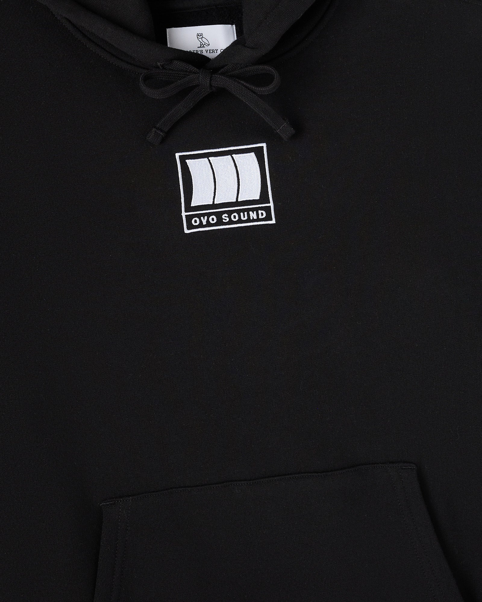 Black hoodie with white OVO Sound logo on chest and drawstring at neckline.