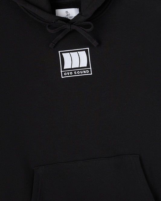 Black hoodie with white OVO Sound logo on chest and drawstring at neckline.