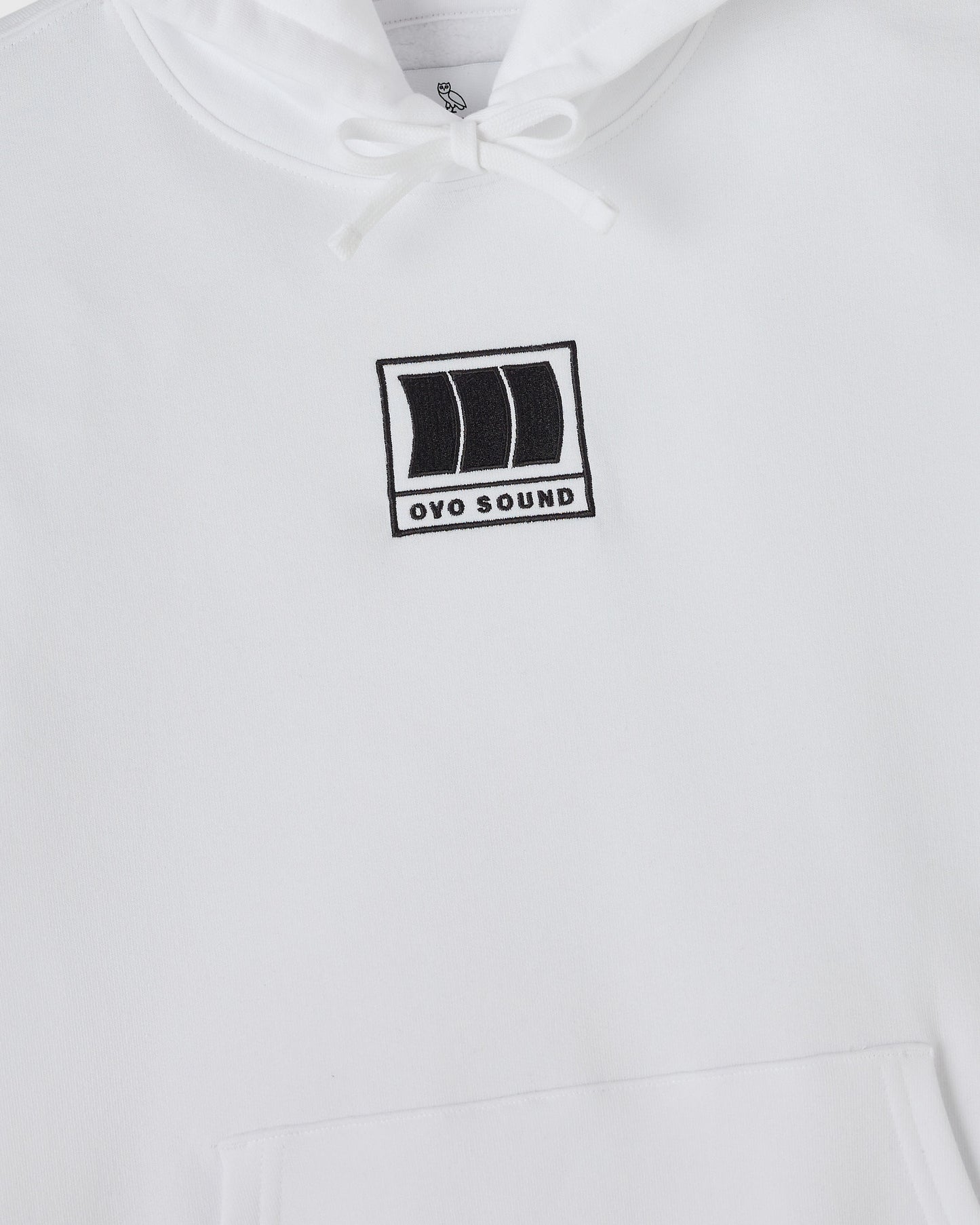 White hoodie with drawstring hood and black OVO Sound rectangular logo print on chest.
