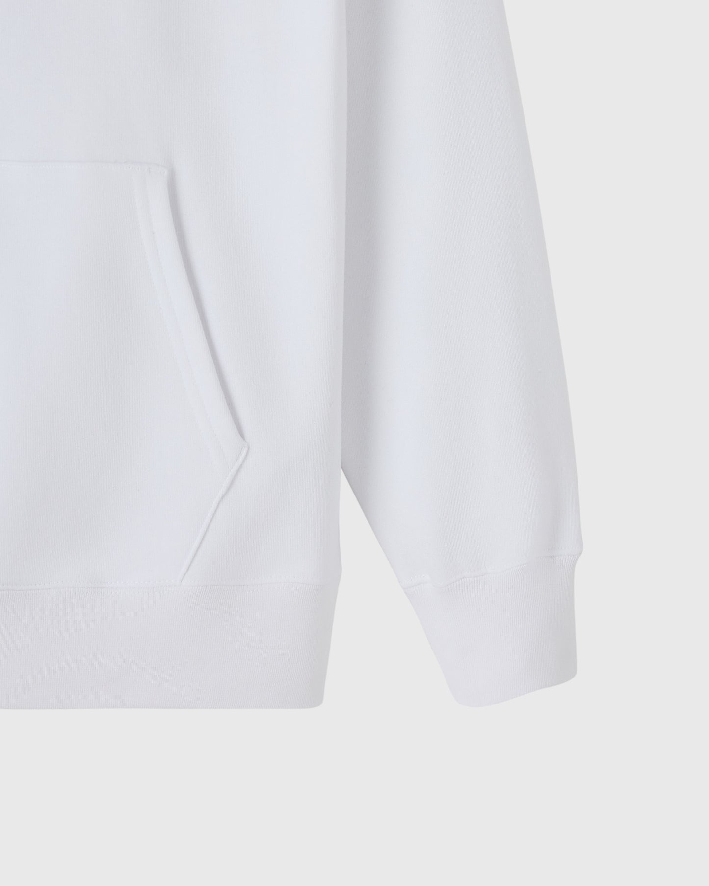 White hoodie with kangaroo pocket and ribbed cuffs, shown from front detail view.