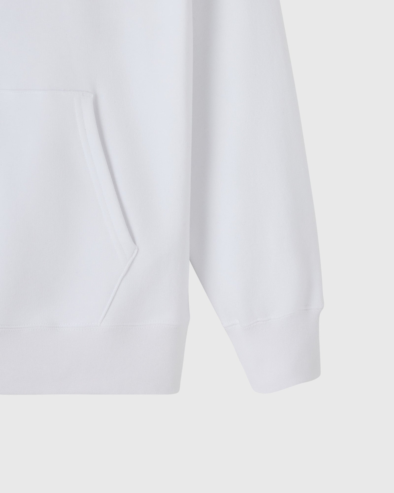 White hoodie with kangaroo pocket and ribbed cuffs, shown from front detail view.