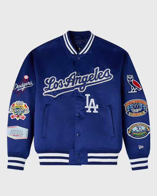 Navy blue Los Angeles Dodgers varsity jacket with white striping, embroidered logos on sleeves, and button front closure.