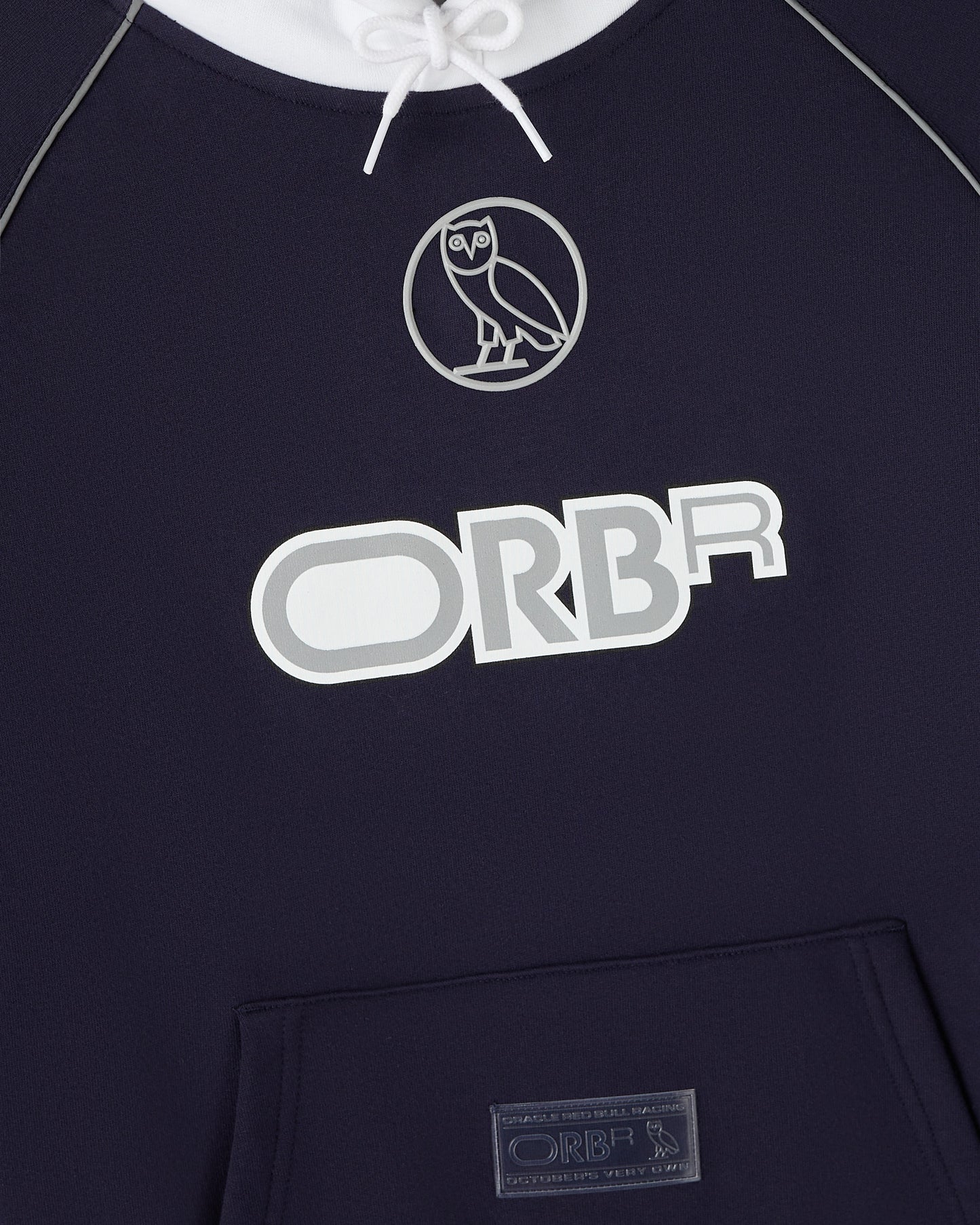 Navy hoodie with white drawstring, owl logo, and "ORBR" text on chest with kangaroo pocket.