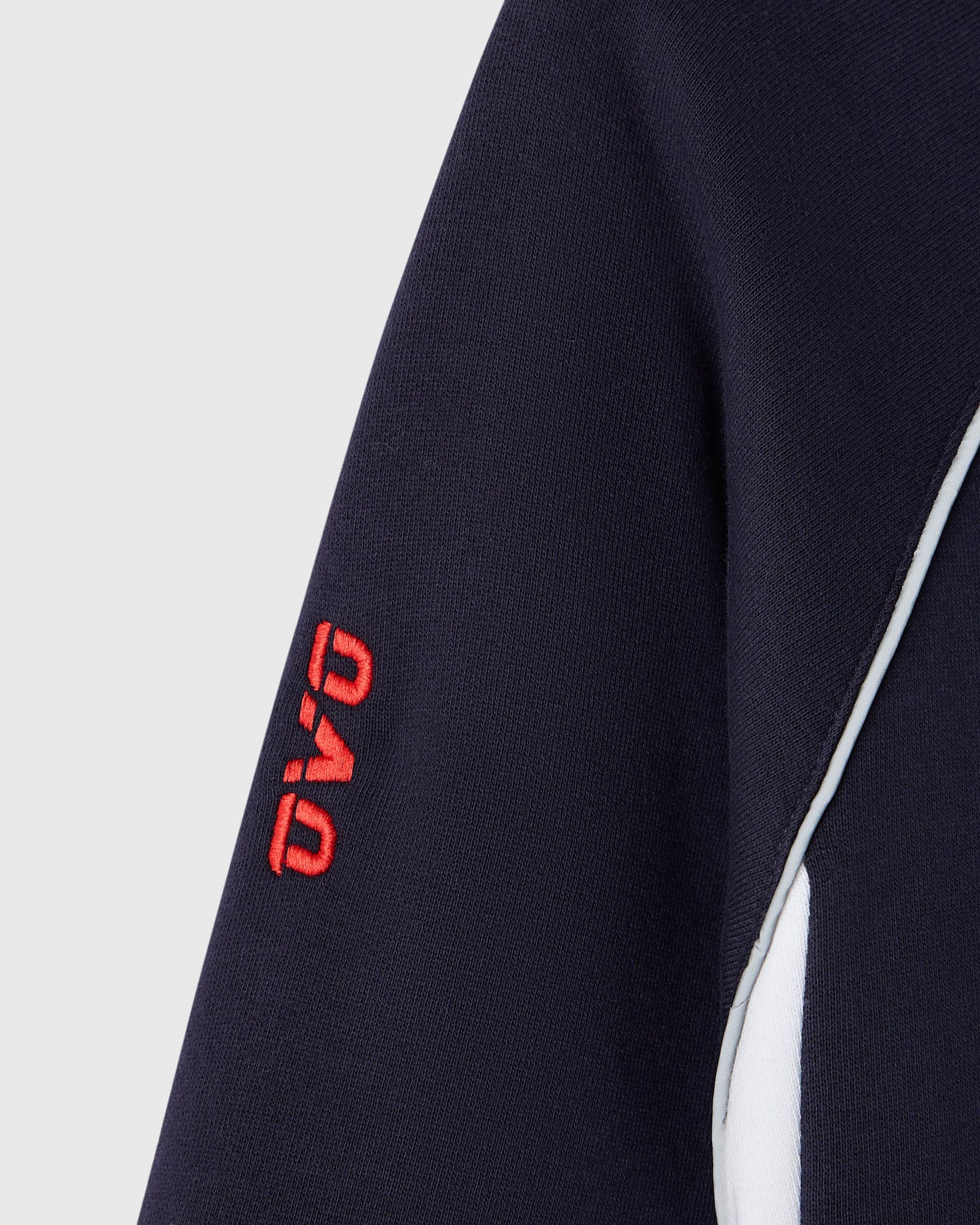 Navy hoodie with red embroidered logo and white side stripe detail.