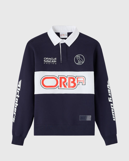 Navy fleece rugby shirt with white collar, Oracle Red Bull Racing and ORBA branding, owl logo, and white sleeve graphics.