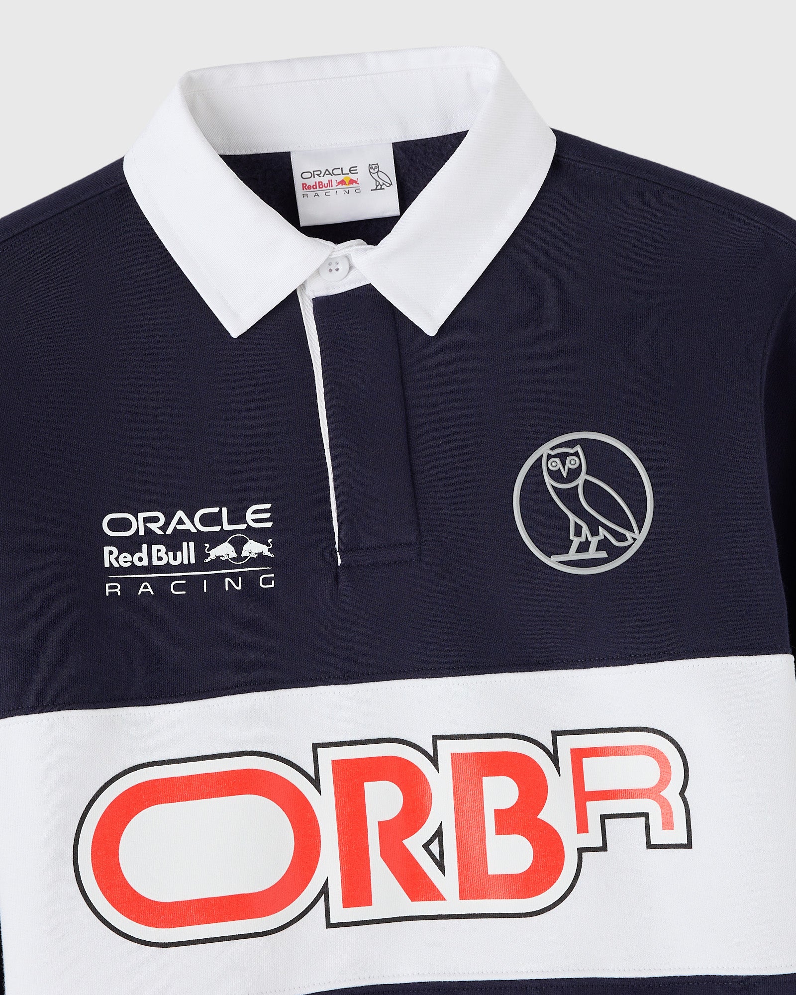 Navy and white fleece rugby with Oracle Red Bull Racing branding and owl logo on chest.