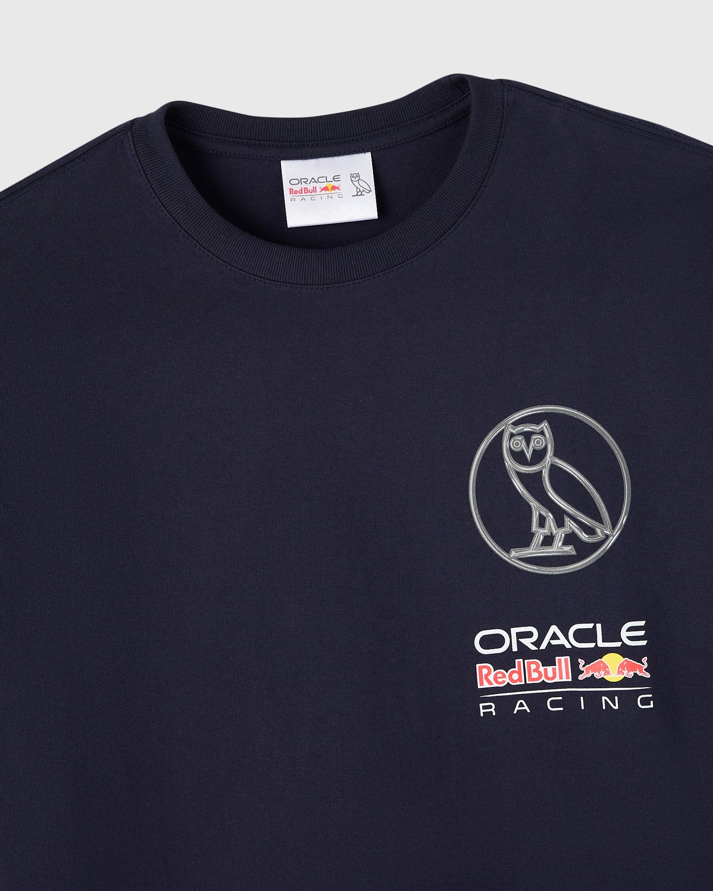 Navy long-sleeve t-shirt with Oracle Red Bull Racing logo and owl emblem on chest.