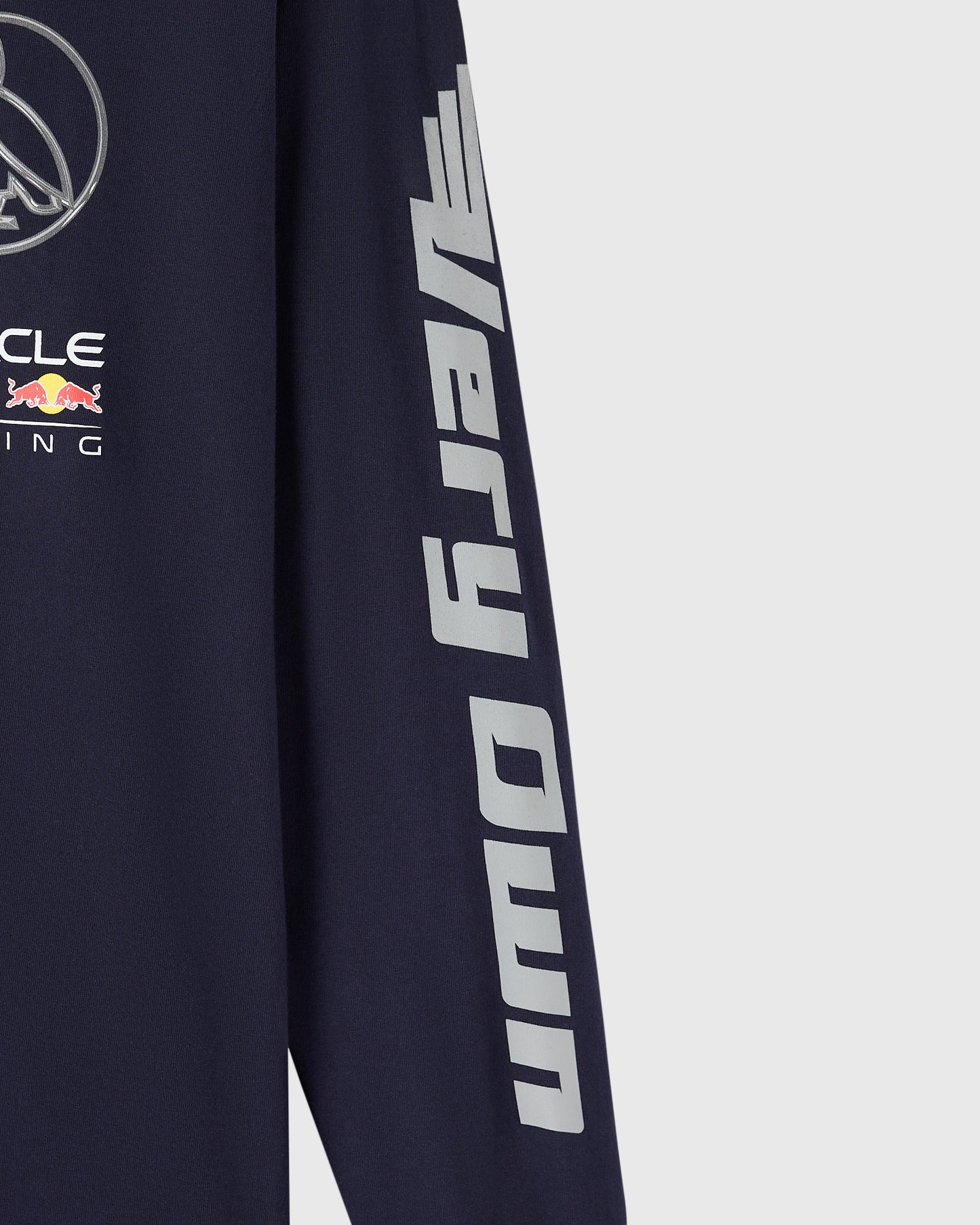 Navy long-sleeve tee with Red Bull Racing branding and gray text down the sleeve.