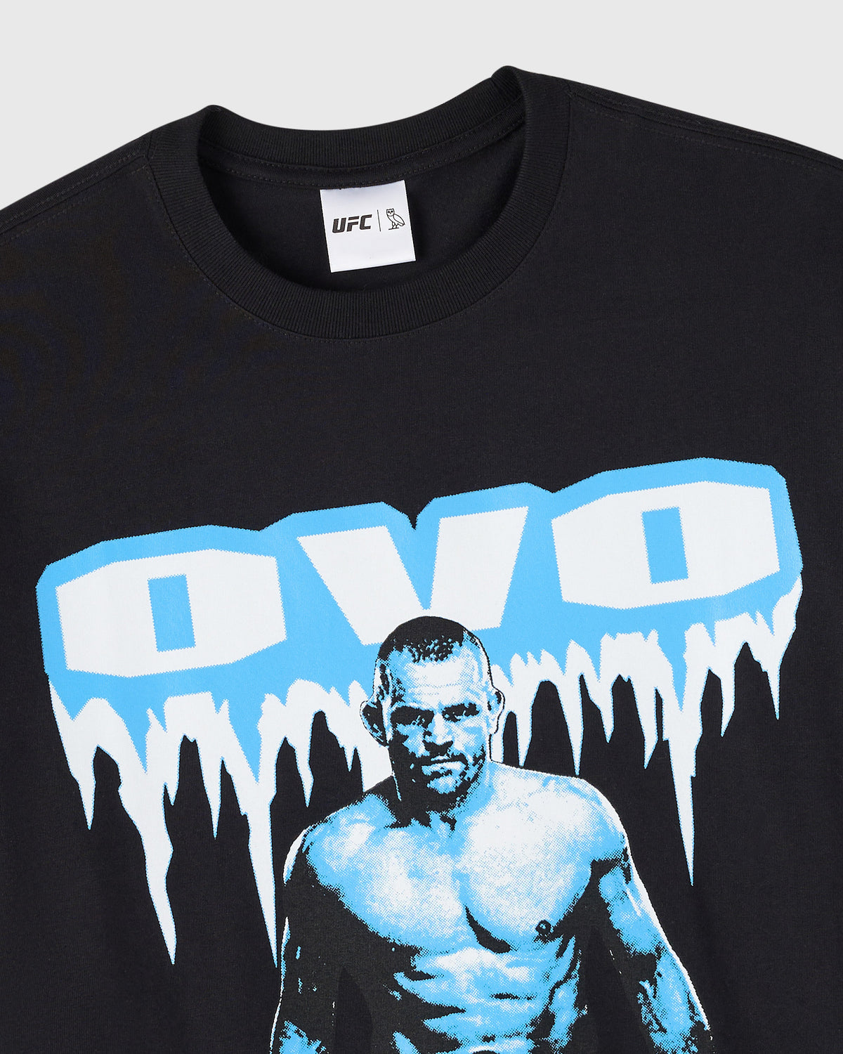 Black crewneck t-shirt with UFC logo label and blue and white graphic print featuring a fighter's portrait.