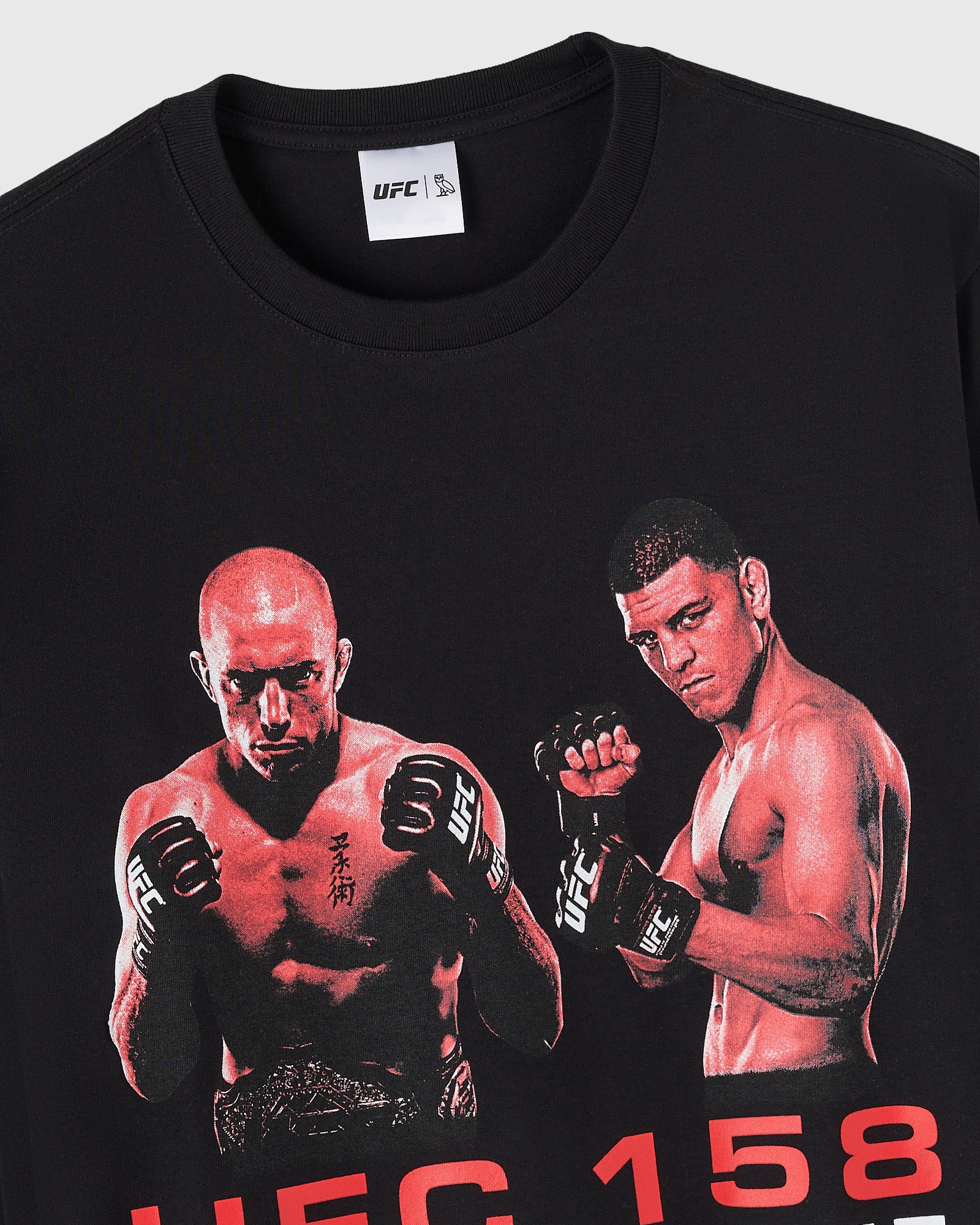 Close up of black long-sleeve tee with UFC GSP vs Diaz graphic featuring two fighters in fighting stance and red text 