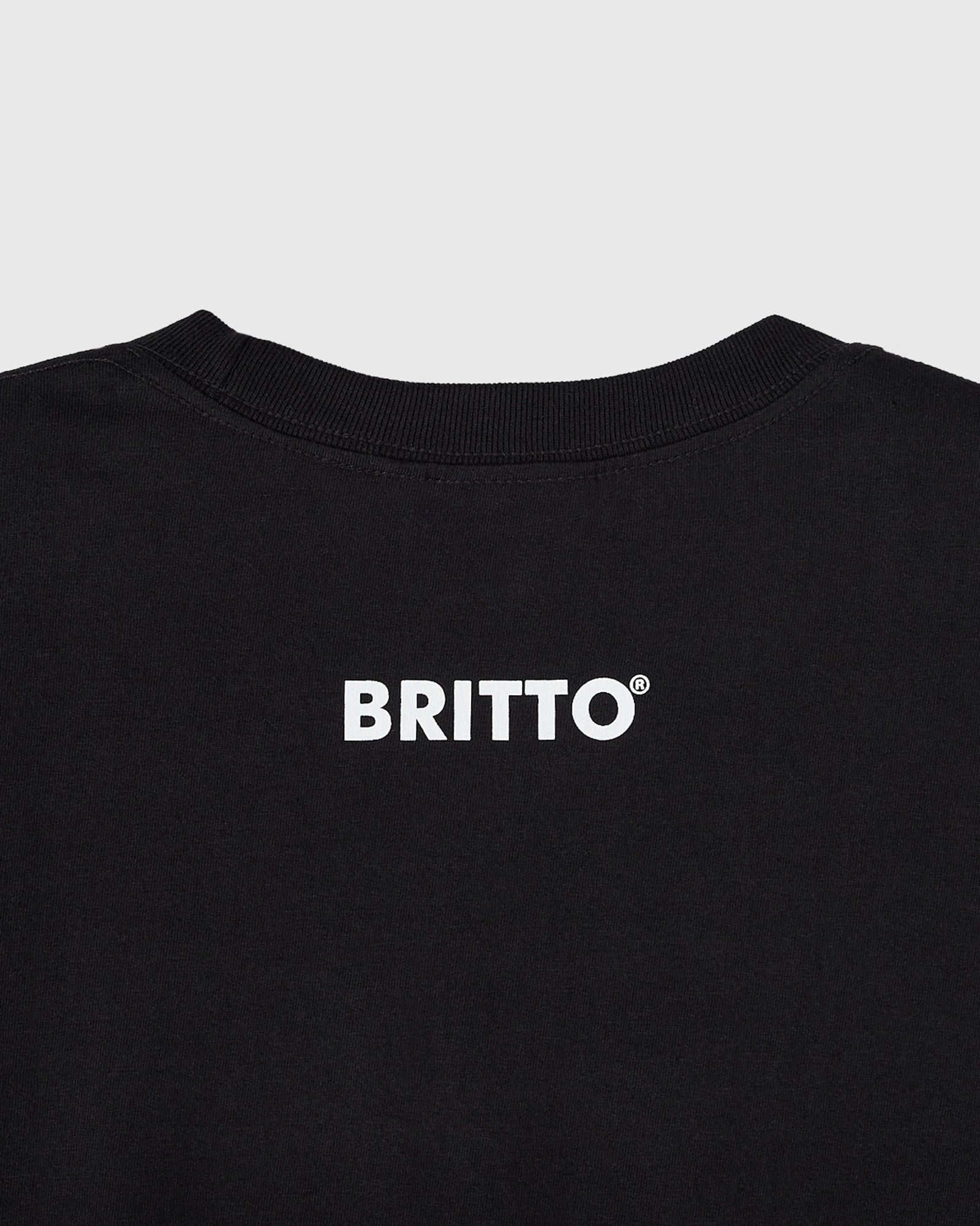 Black t-shirt with white "BRITTO" text and registered trademark symbol on chest.
