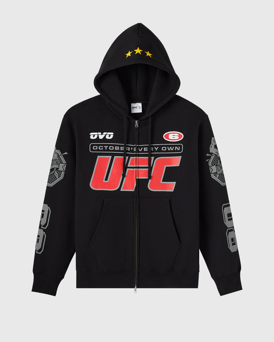 Black full-zip hoodie with UFC branding, red logo, yellow stars on hood, and gray sleeve graphics.