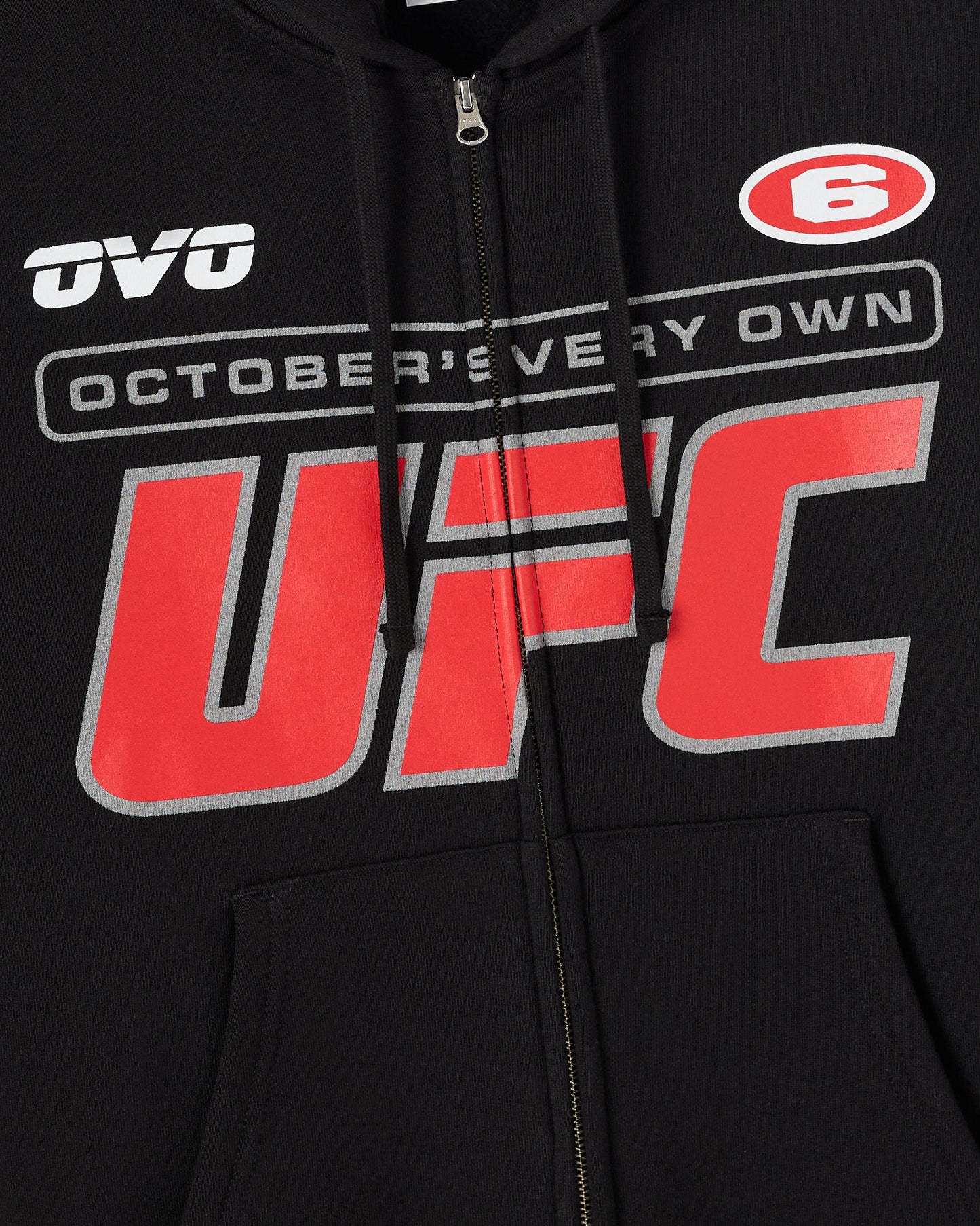 Black hoodie with full-length silver zipper and red UFC logo graphic with "October's Every Own" text on chest.
