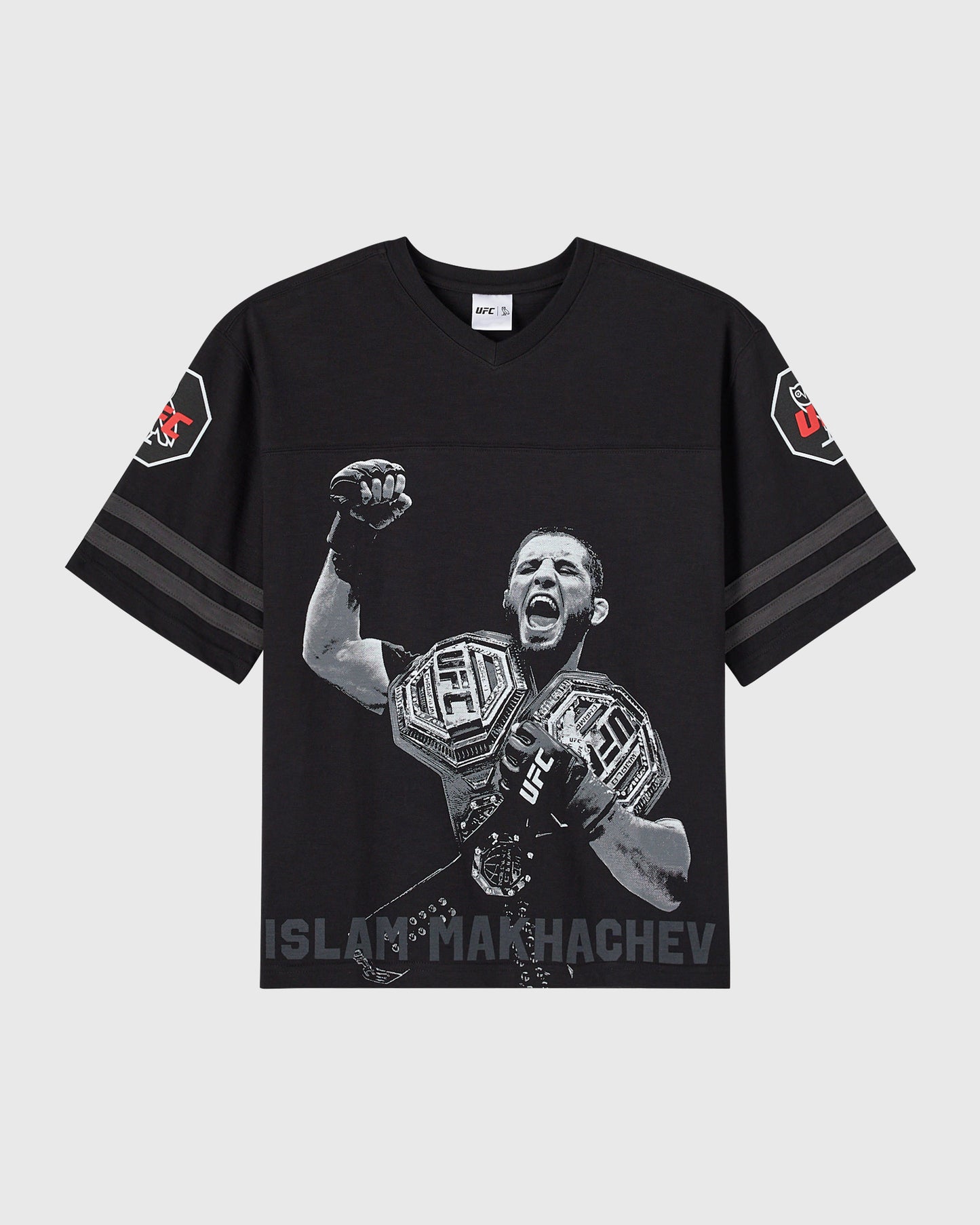 Black short-sleeve tee with UFC fighter Islam Makhachev graphic, striped sleeves, and shoulder patches.