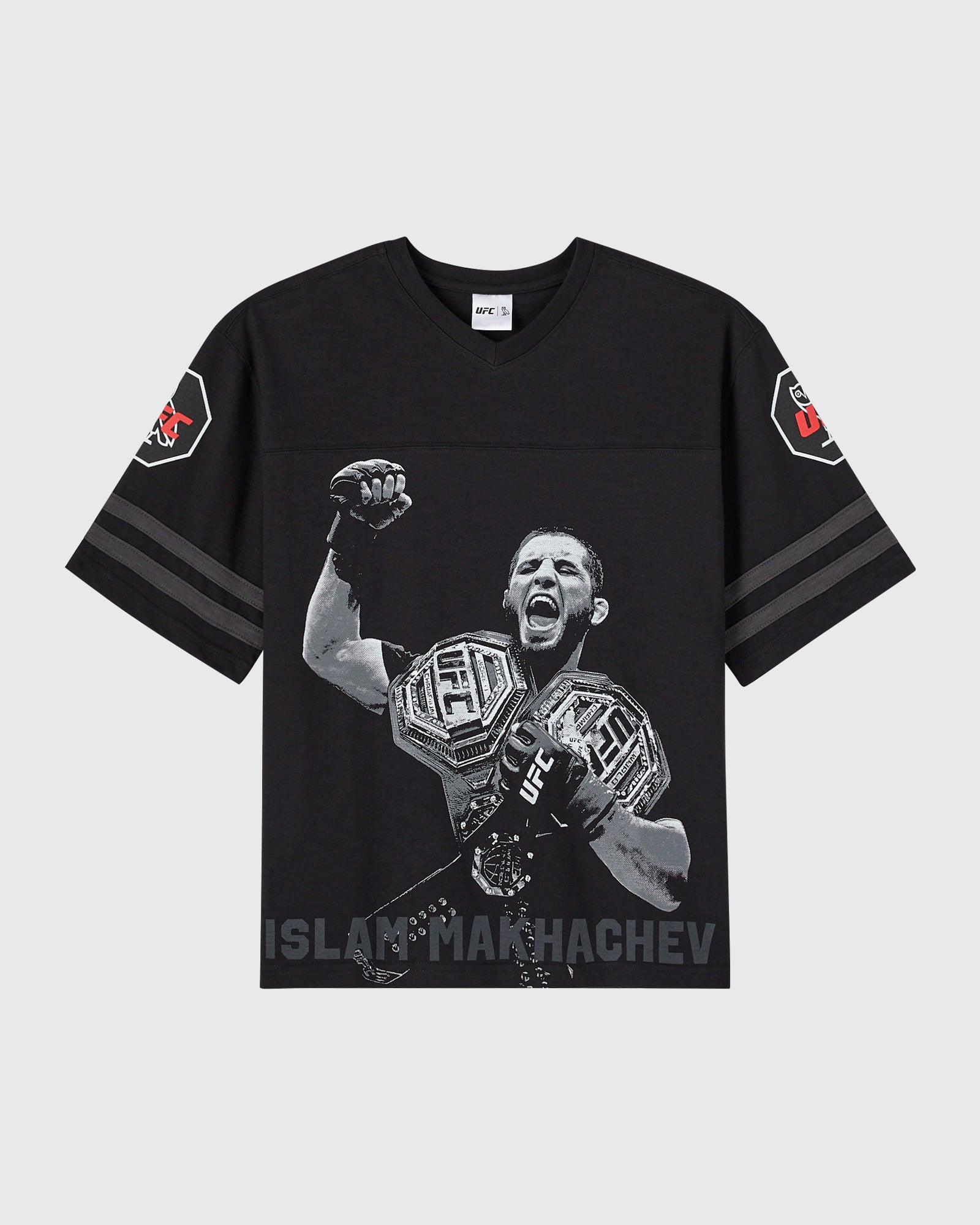 Black short-sleeve tee with UFC fighter Islam Makhachev graphic, striped sleeves, and shoulder patches.