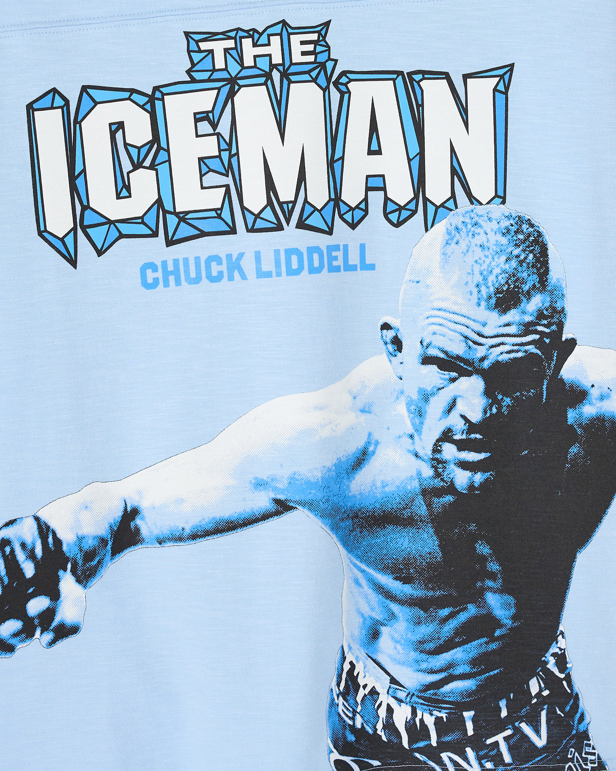 Light blue t-shirt featuring "The Iceman" text in outlined letters and Chuck Liddell portrait graphic in blue and black tones