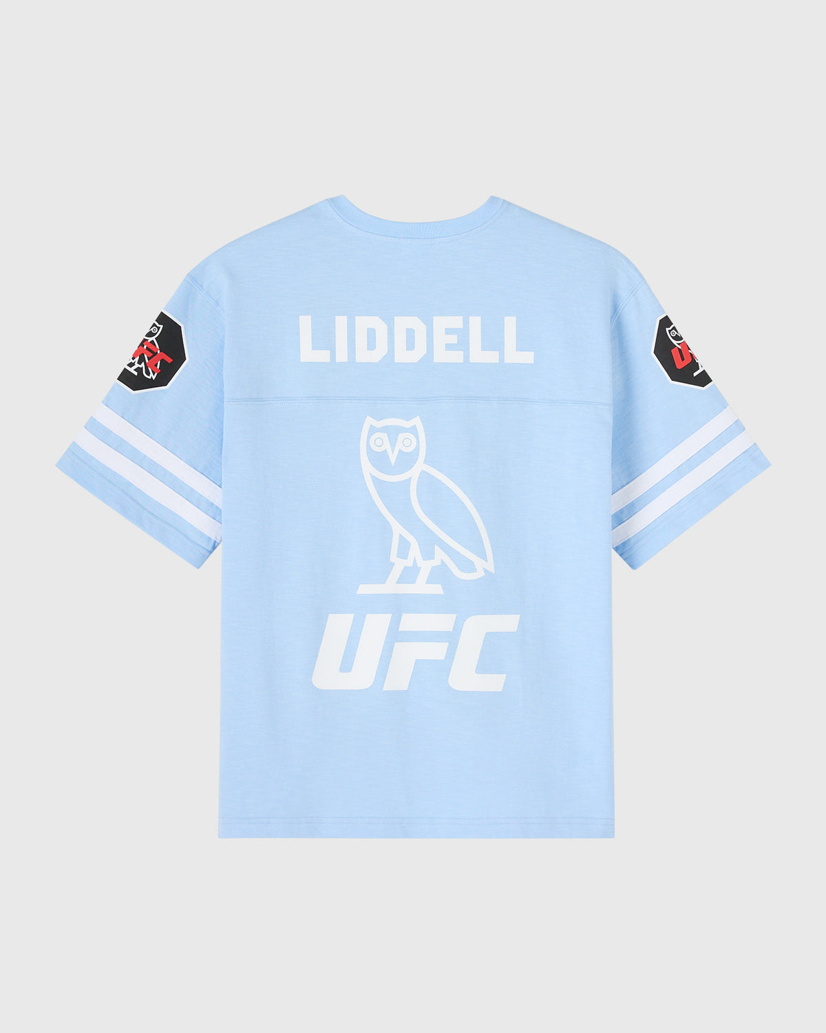 Light blue football tee with "Liddell" text, owl graphic, and UFC logo on back with sleeve patches.