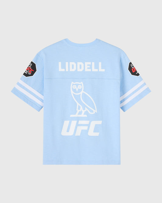Light blue football tee with "Liddell" text, owl graphic, and UFC logo on back with sleeve patches.