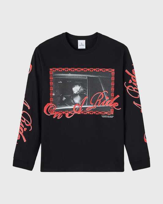 Black long-sleeve tee with red heart border graphic and text design on chest and sleeves.