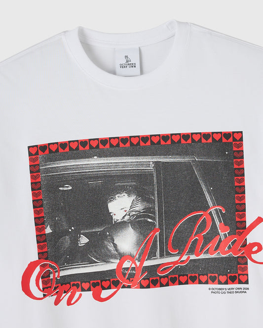 White t-shirt with black and white vintage photograph surrounded by red heart border and red script text.