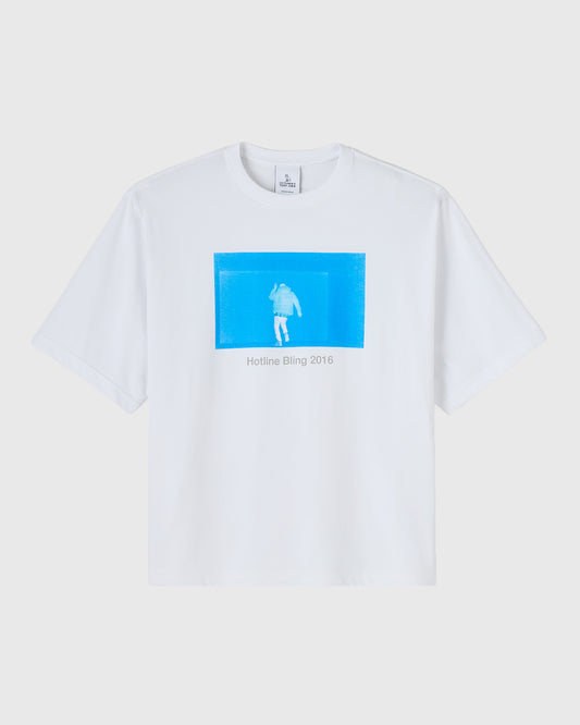 White t-shirt with blue rectangular graphic featuring a figure silhouette and "Hotline Bling 2016" text.