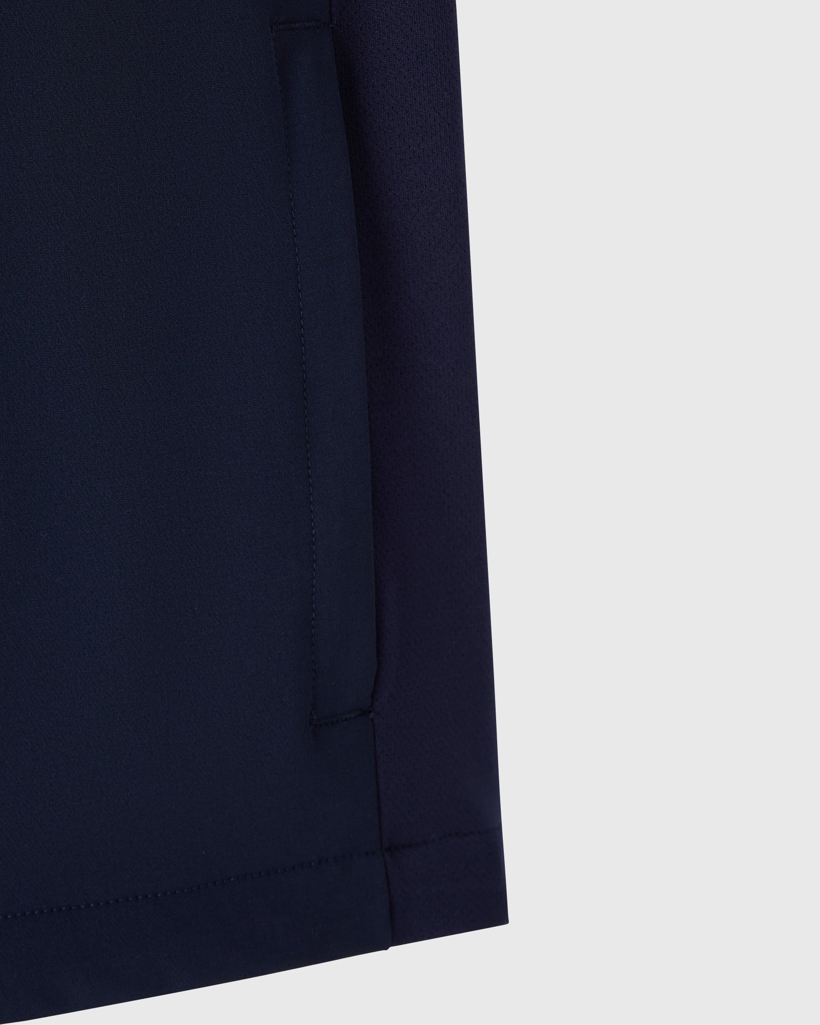 Navy nylon vest with vertical seam detail and reflective print design.
