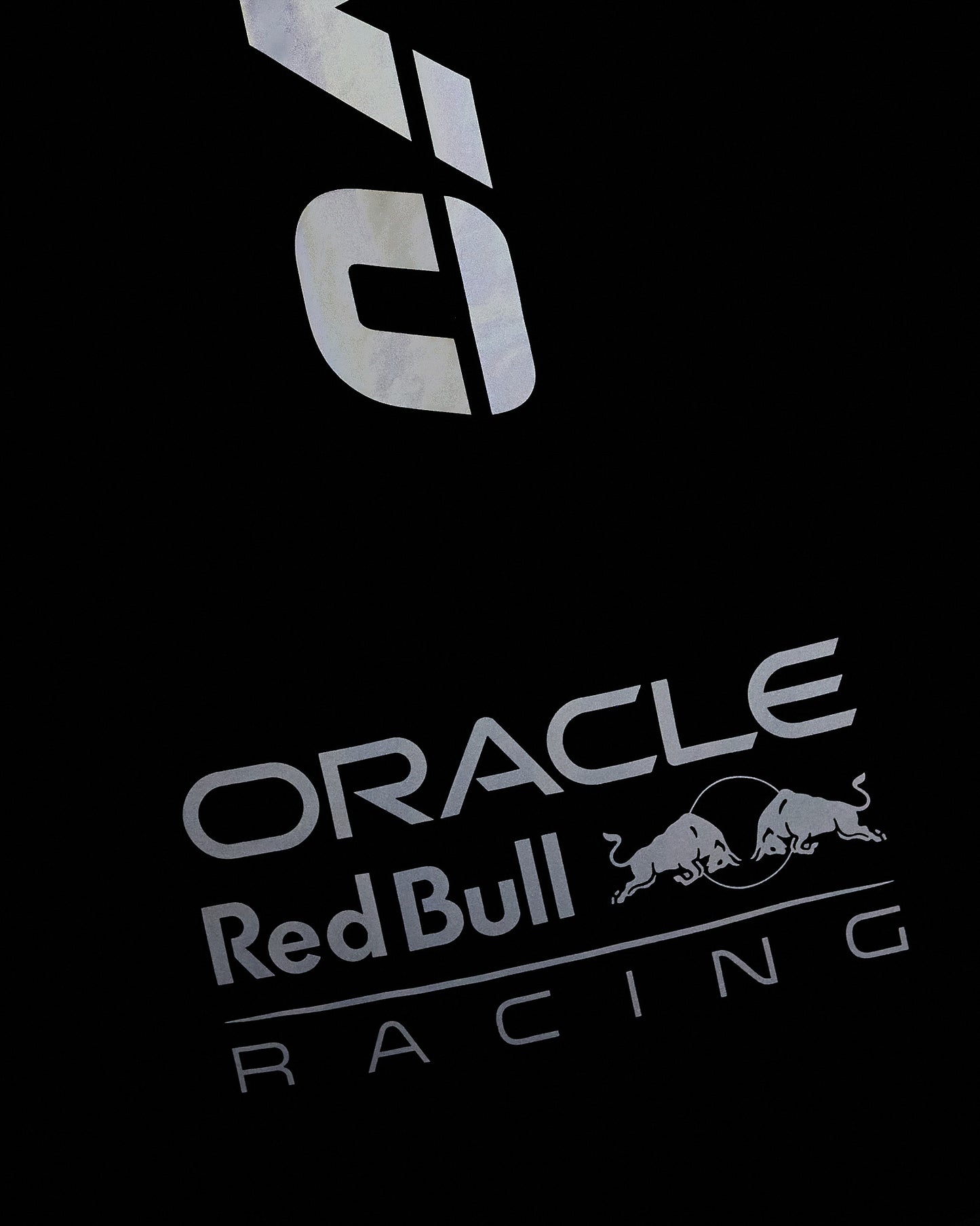 Navy nylon vest with reflective Oracle Red Bull Racing logo and bull graphic print.