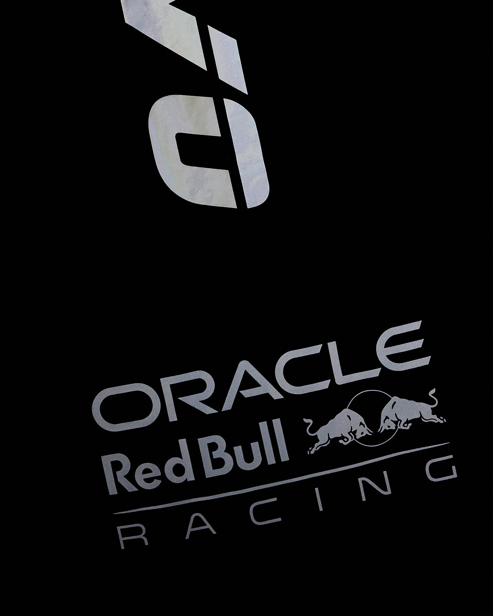 Navy nylon vest with reflective Oracle Red Bull Racing logo and bull graphic print.