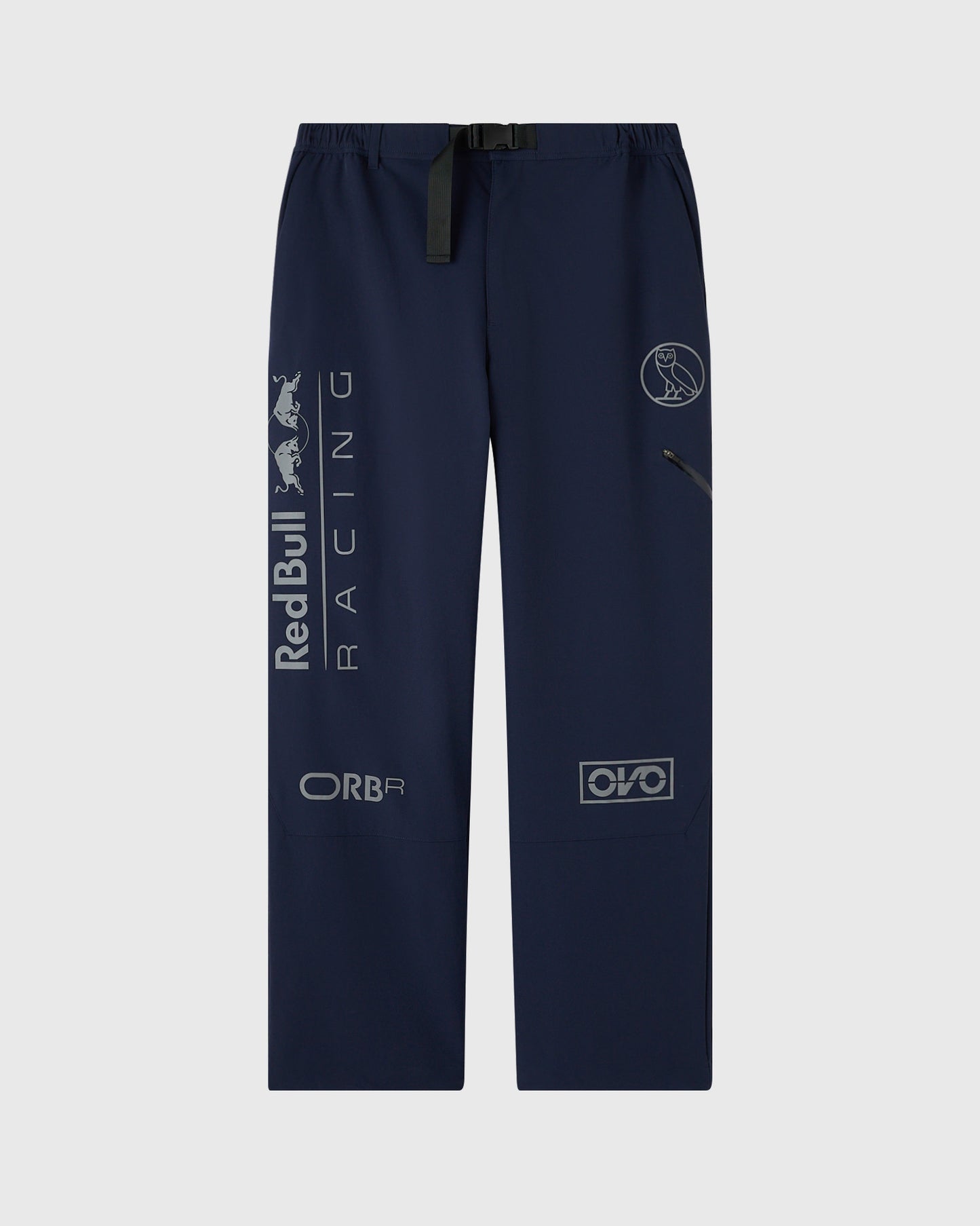 Navy nylon pants with reflective Red Bull Racing and sponsor logos printed across legs and waistband belt.