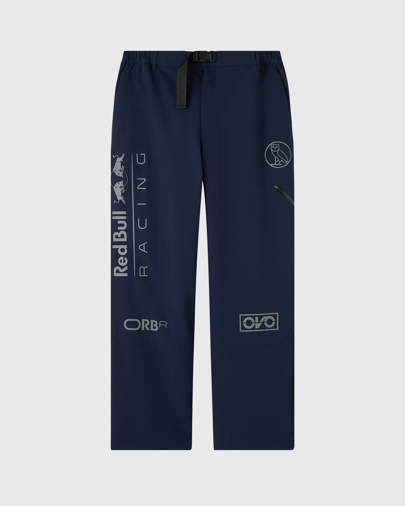 Navy nylon pants with reflective Red Bull Racing and sponsor logos printed across legs and waistband belt.