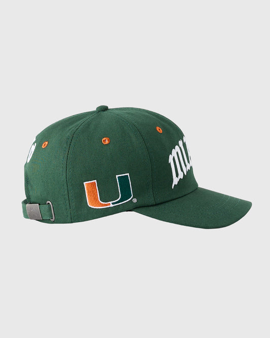 Green baseball cap with University of Miami logo featuring orange and white "U" emblem, white text on side, and adjustable ba