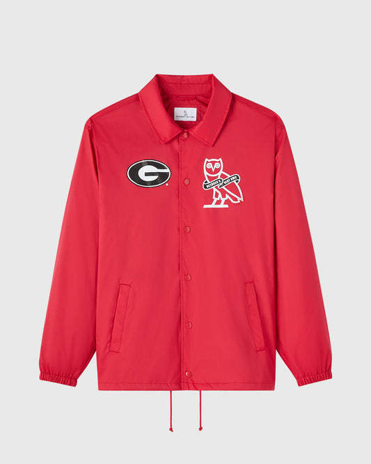 Red coaches jacket with Georgia "G" logo and owl mascot emblem on chest, button front closure, and drawstring hem.