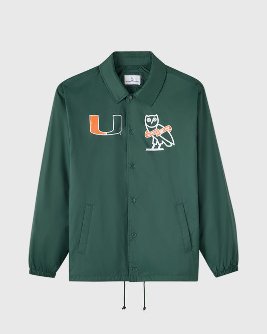 Green coaches jacket with University of Miami "U" logo and owl mascot emblem on chest, button front, and drawstring hem.