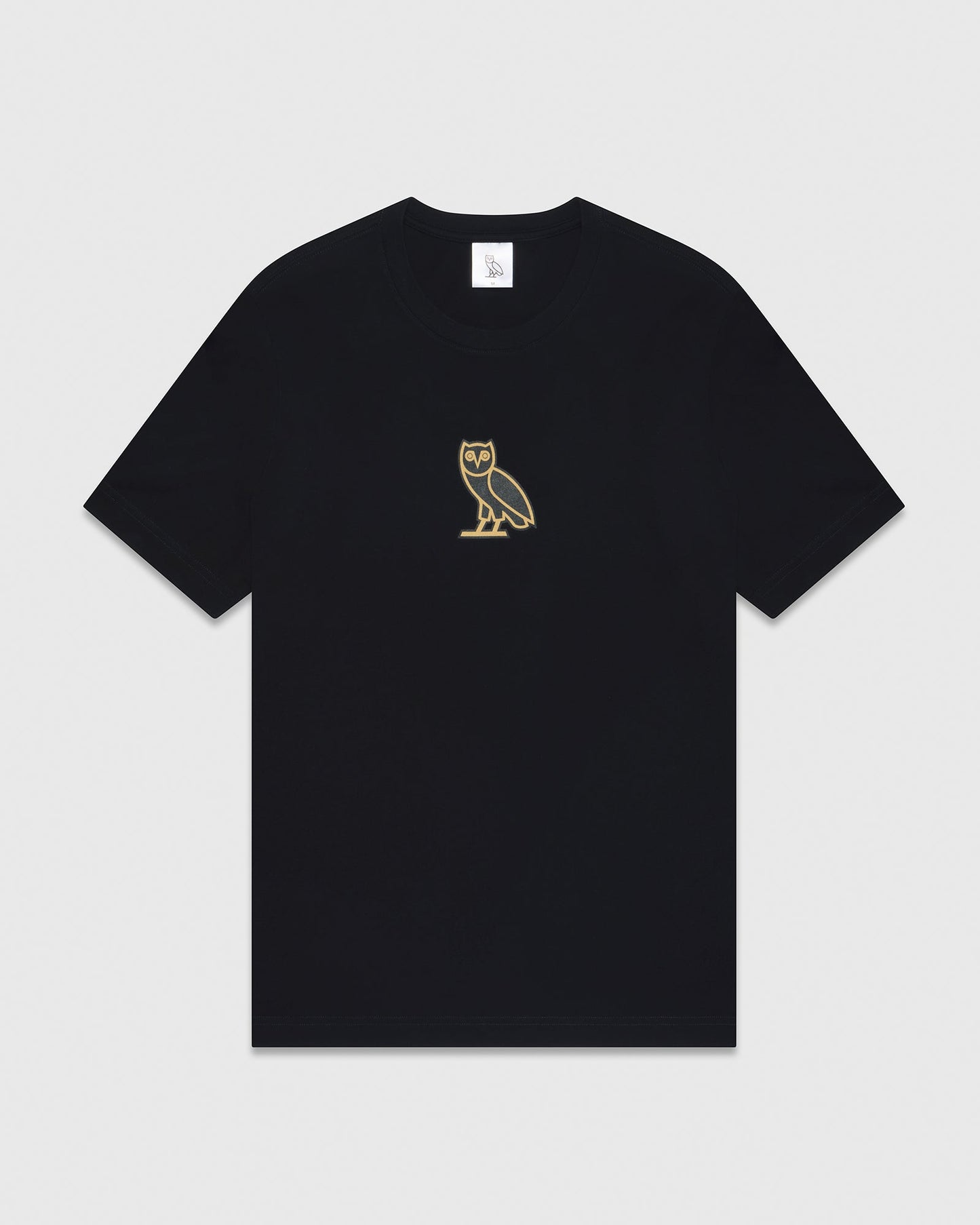 Black short-sleeve t-shirt with small gold owl embroidery on chest.