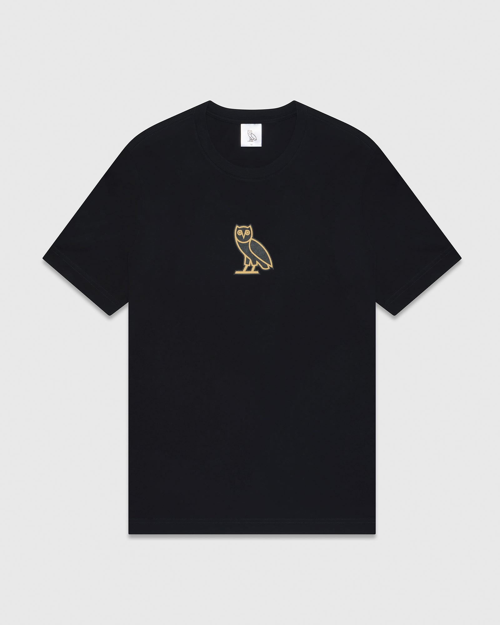Black short-sleeve t-shirt with small gold owl embroidery on chest.