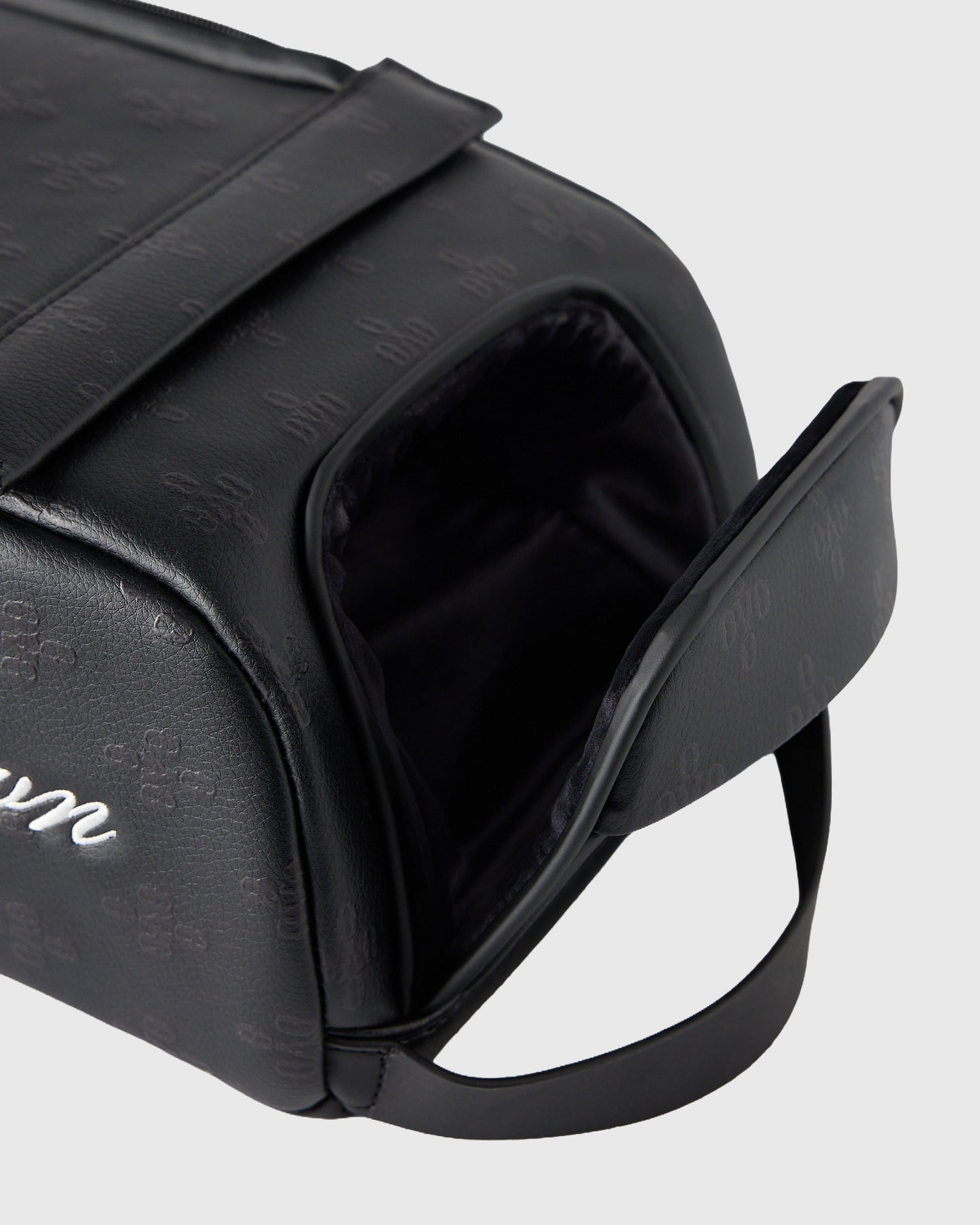 Black Vessel Monogram Greenside Shag Bag with open top showing black interior and carrying handle.