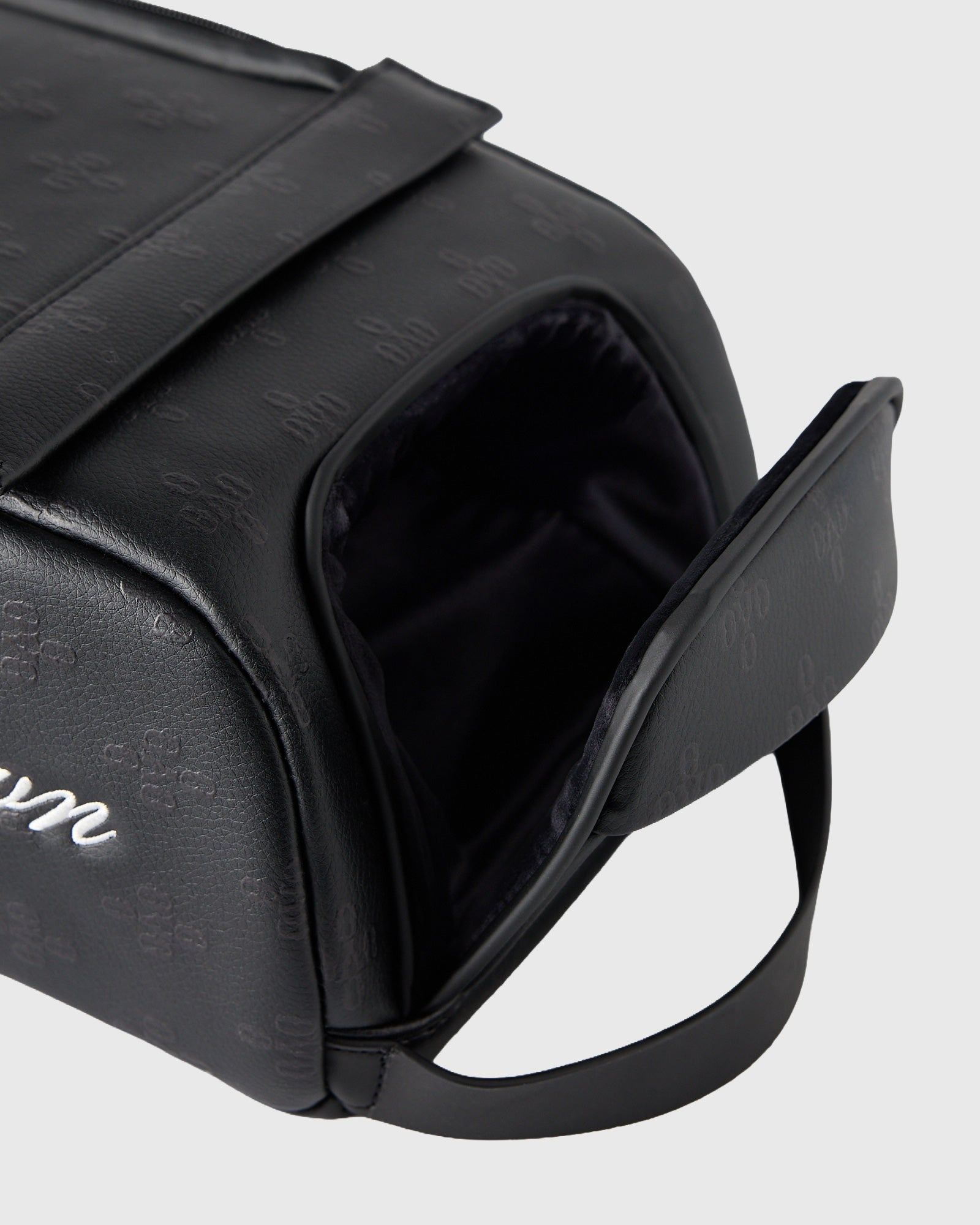 Black Vessel Monogram Greenside Shag Bag with open top showing black interior and carrying handle.