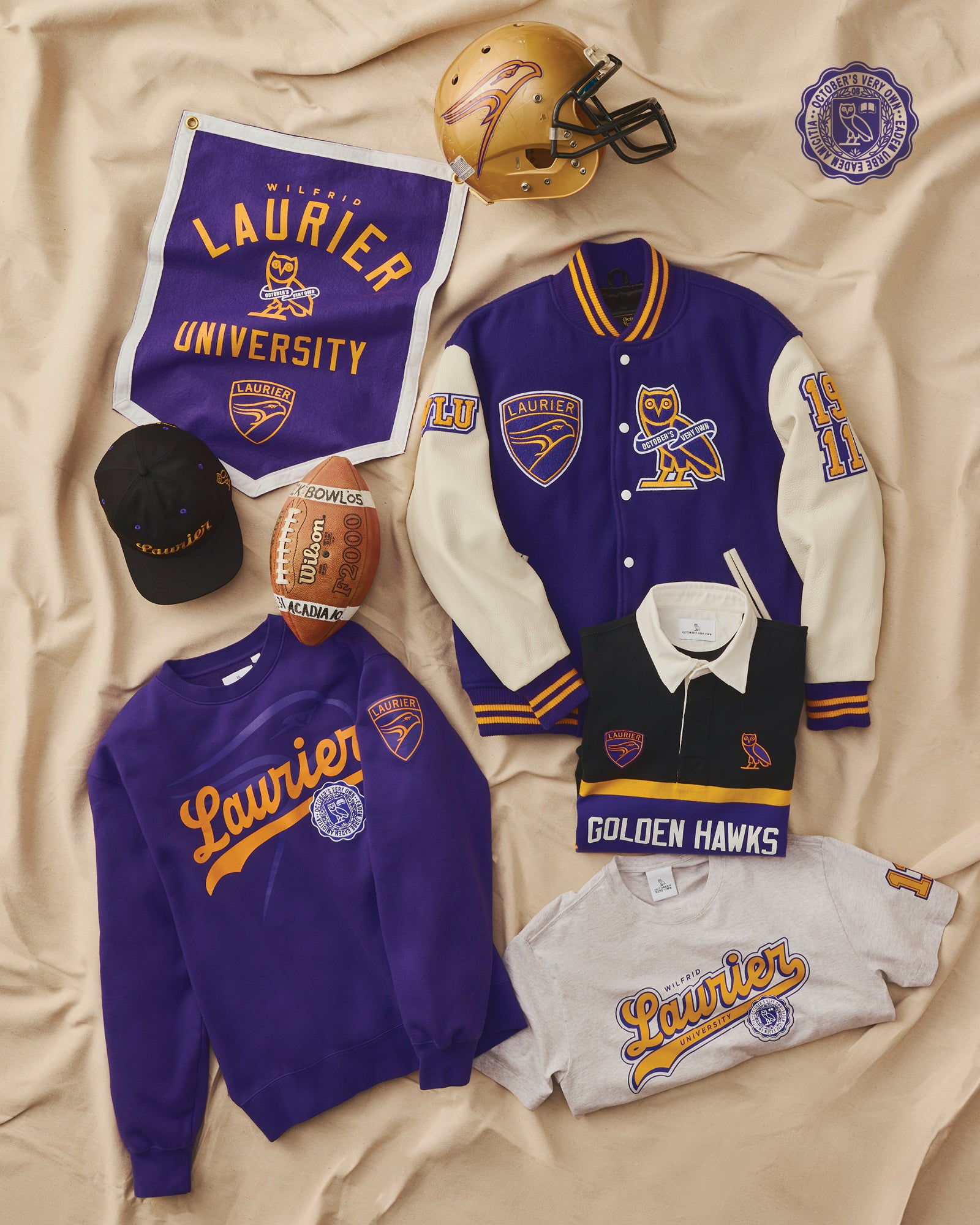 October's Very Own Campus Collection 2025 featuring The Varsity Jacket, Hat, Rugby Sweater and Crewnecks from Wilfred Laurier University.