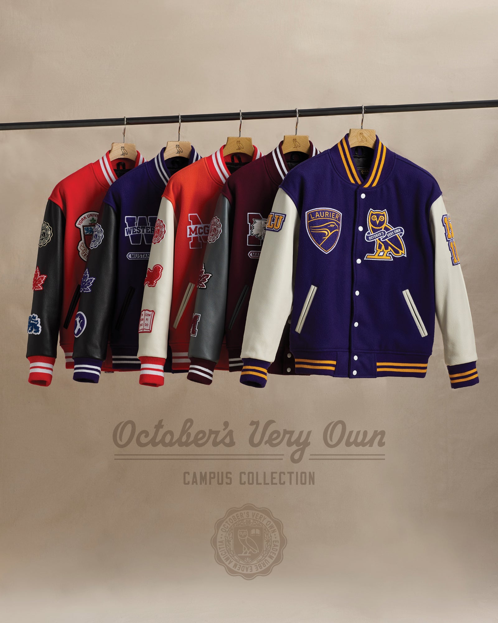 October's Very Own Campus Collection Varsity Jackets on a rack