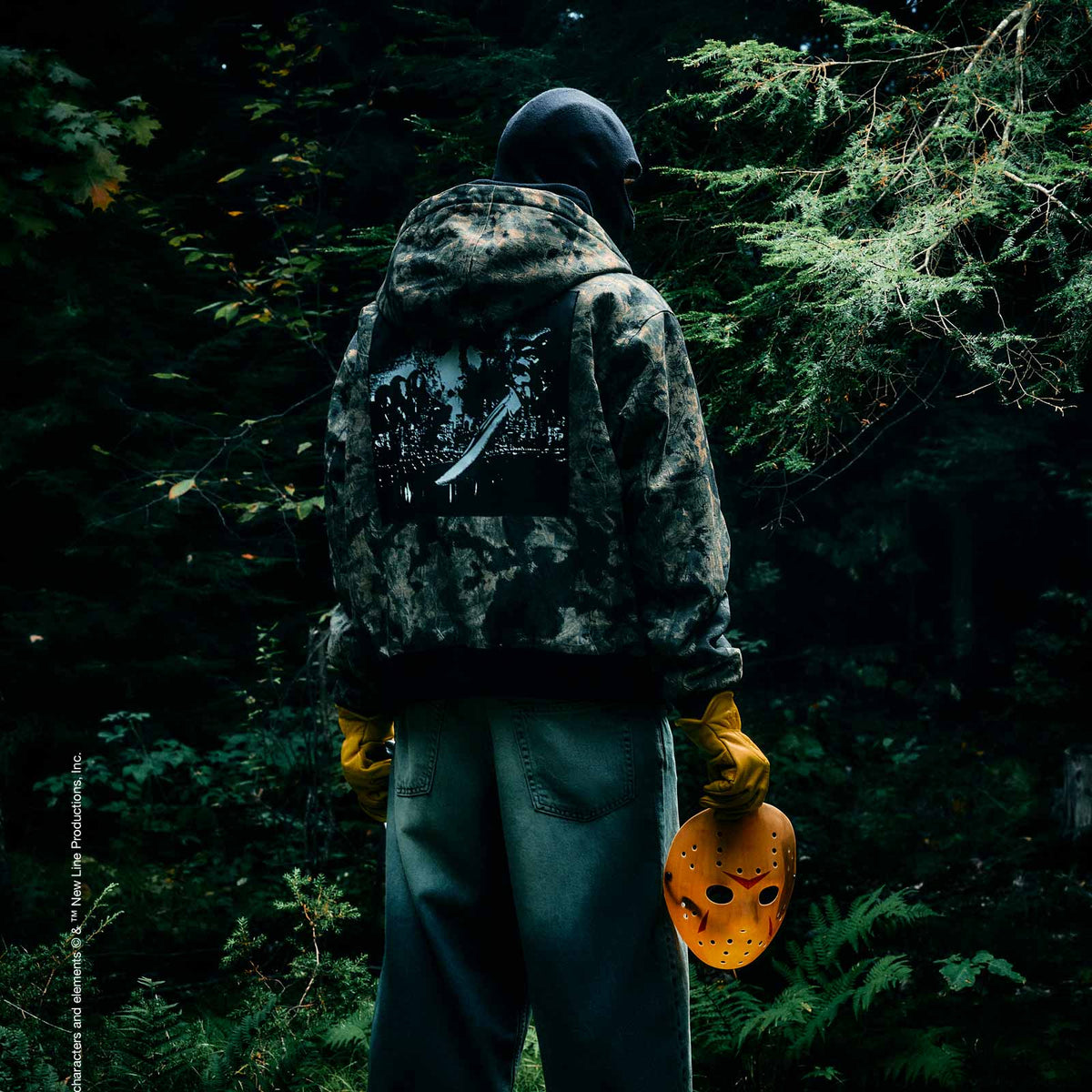 Person standing in the forest wearing October's Very Own clothing