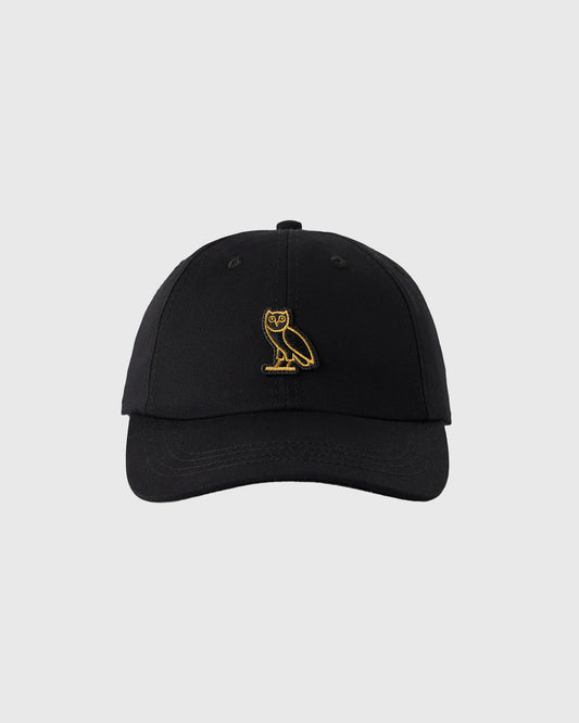 Black baseball cap with gold owl embroidery on front.