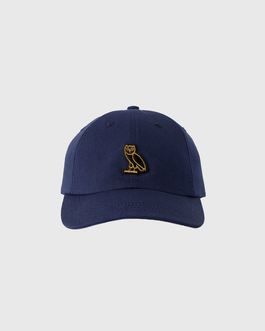 Navy baseball cap with gold owl embroidery on the front.