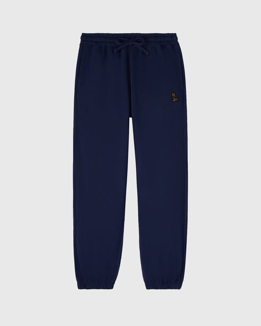 Navy sweatpants with drawstring waist and small embroidered logo on thigh.