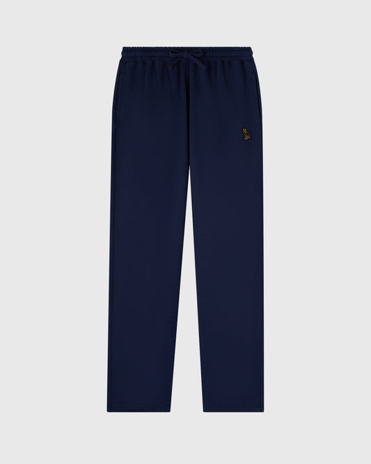Navy sweatpants with drawstring waist, open hems, and small embroidered logo on thigh.