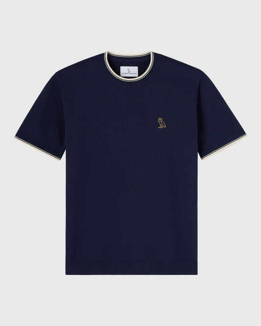 Navy short-sleeve sweater t-shirt with cream tipping on neckline and sleeves, small owl embroidery on chest.