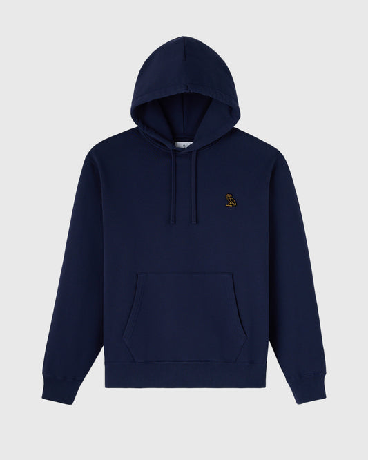 Navy pullover hoodie with drawstring hood, kangaroo pocket, and small embroidered logo on chest.