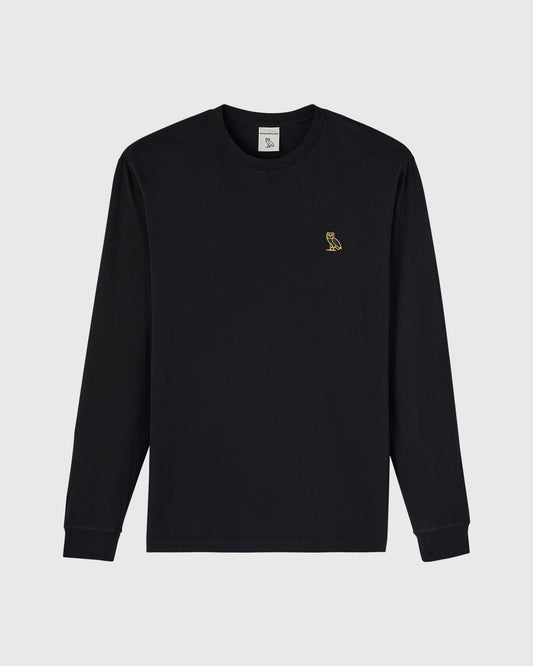 Black long-sleeve crewneck tee with small gold owl embroidered on chest.
