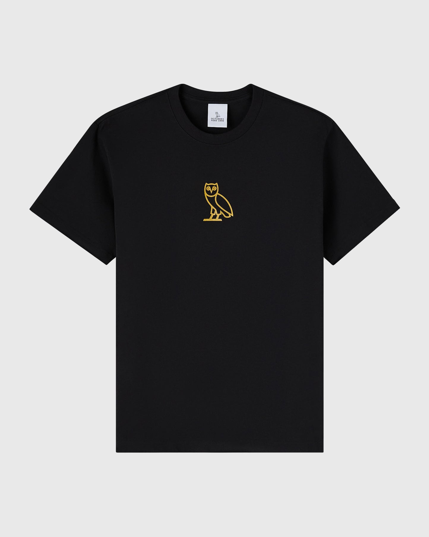 Black crew neck t-shirt with small gold owl emblem on chest.